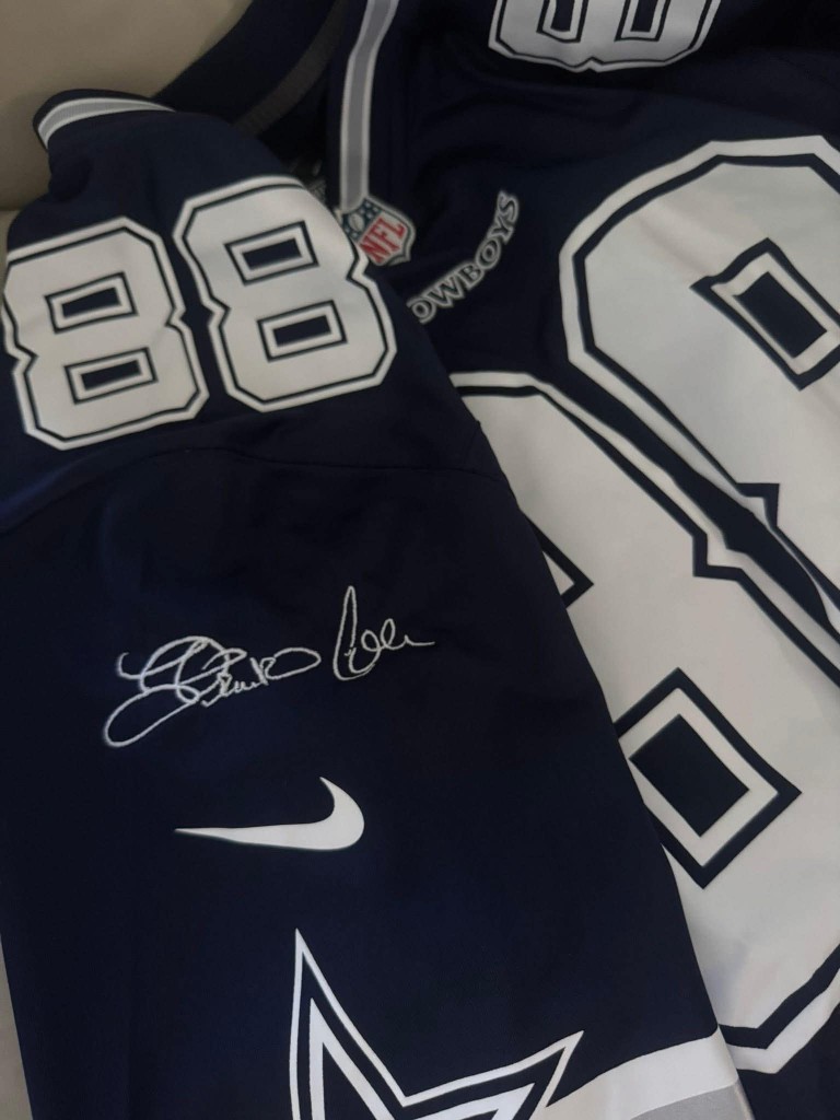 Navy Dallas Cowboys jersey with custom white embroidered signature on the sleeve